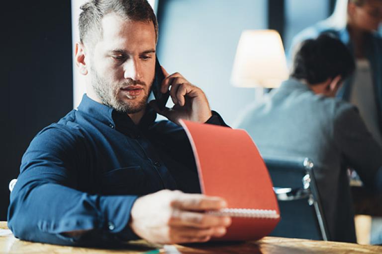 man with notepad