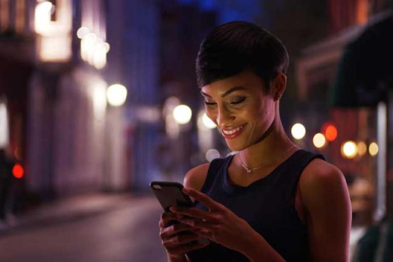 woman with mobile at night