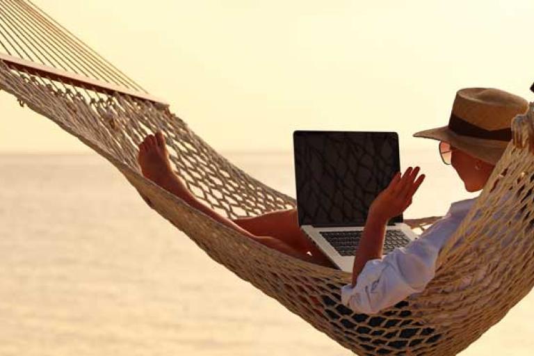 woman on hammock working