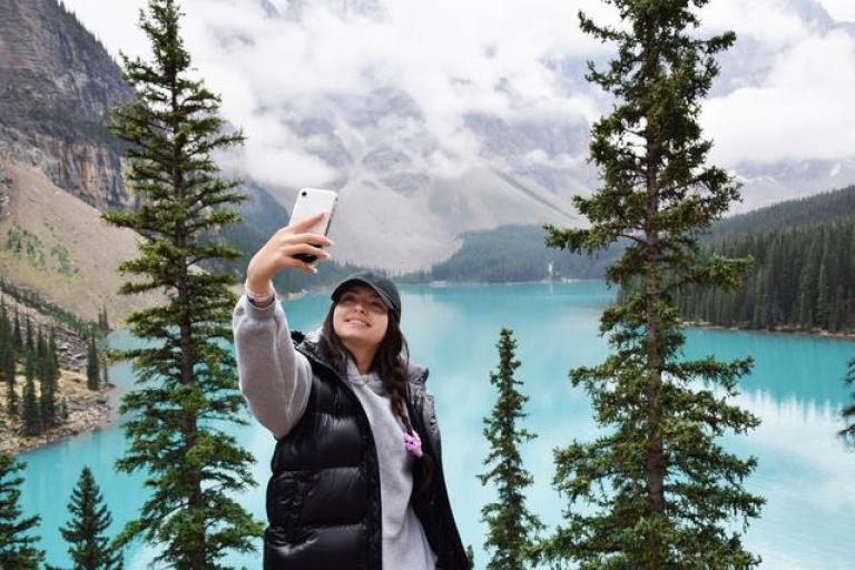 woman taking selfie in the mountains