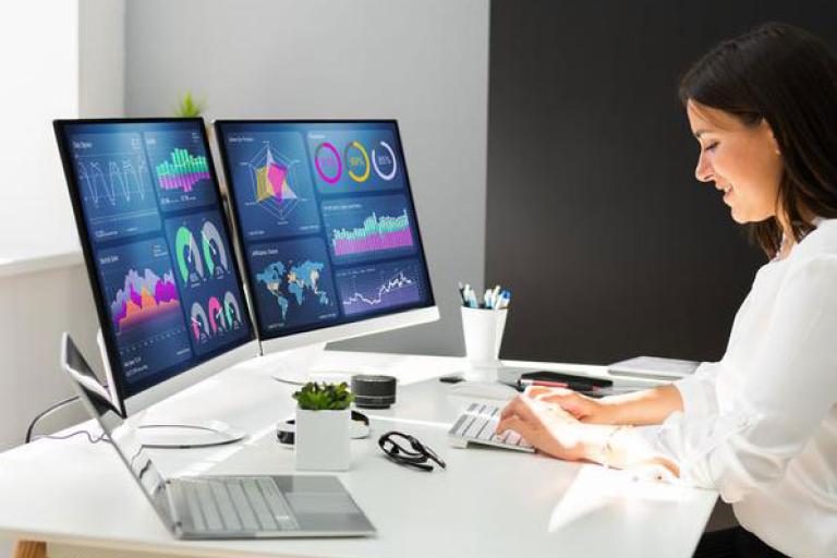 woman with two monitors