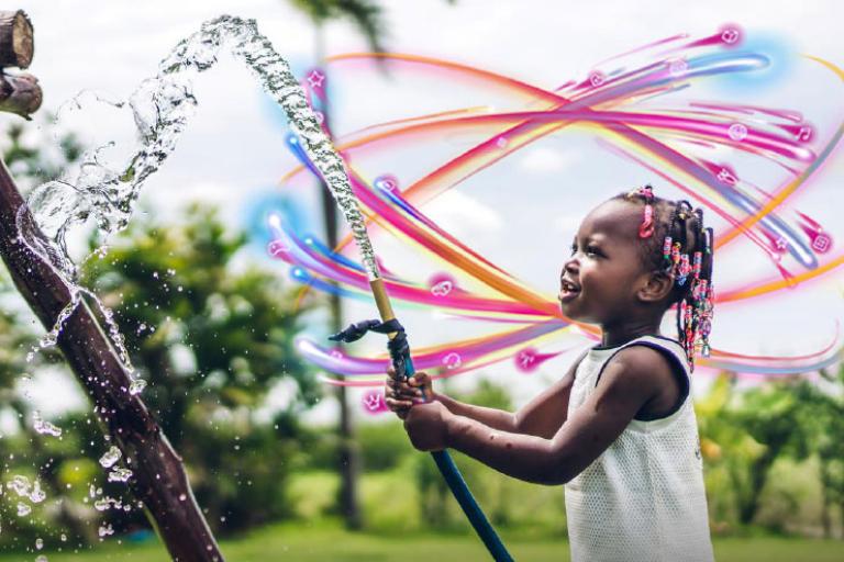 girl playing with hose