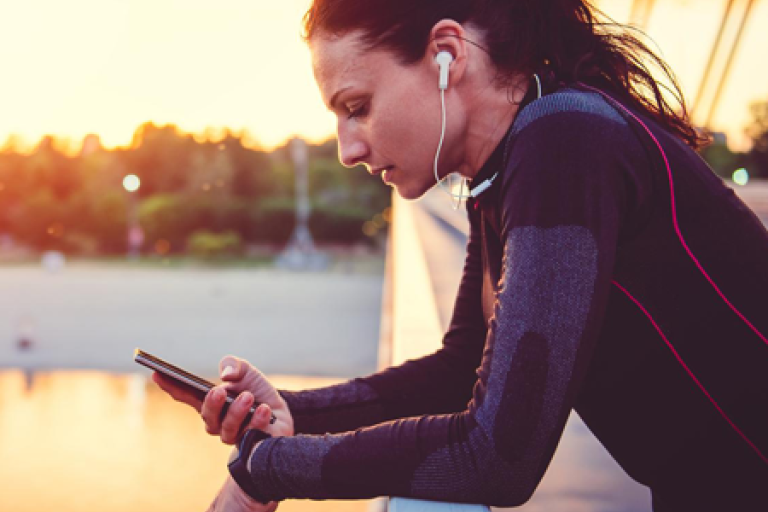 woman on bridge with mobole customer engagement