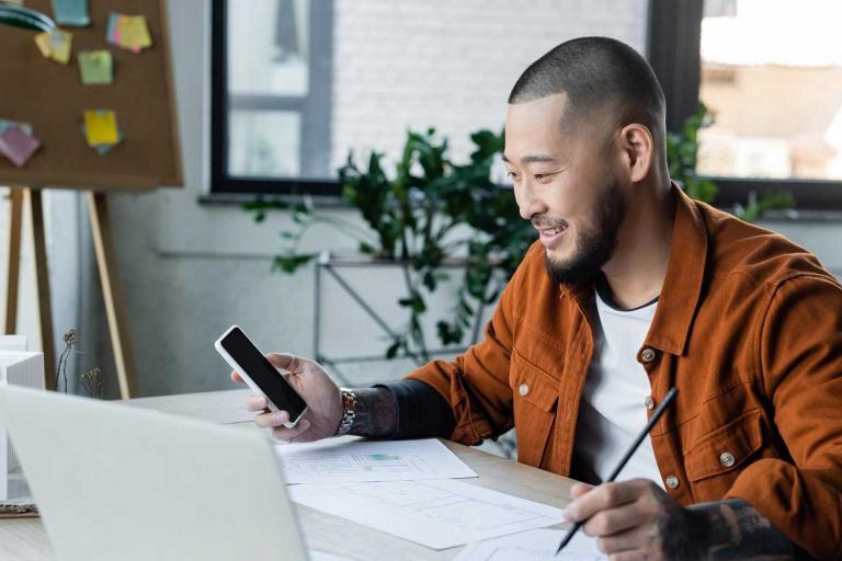 man working with mobile