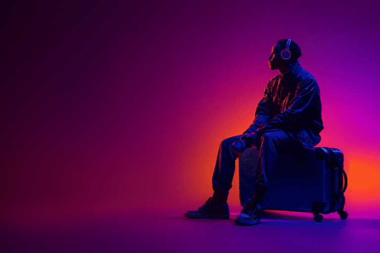man-headphones-suitcase-purple